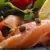 Smoked salmon presented with salad and pepper corns